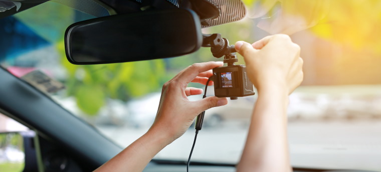Dashcam being adjusted
