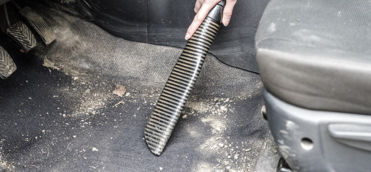 Hoovering the footwell of the car
