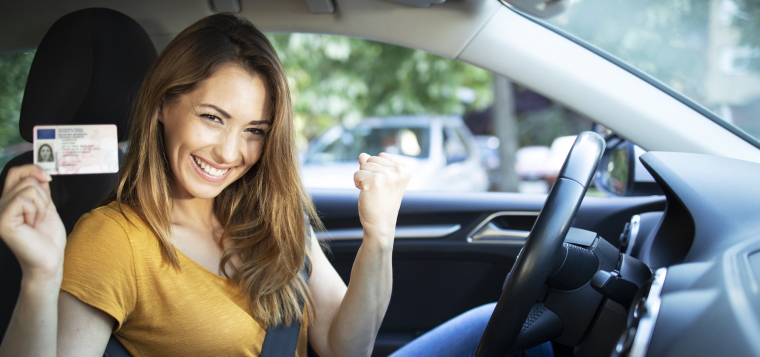 Passed test card and celebrating student